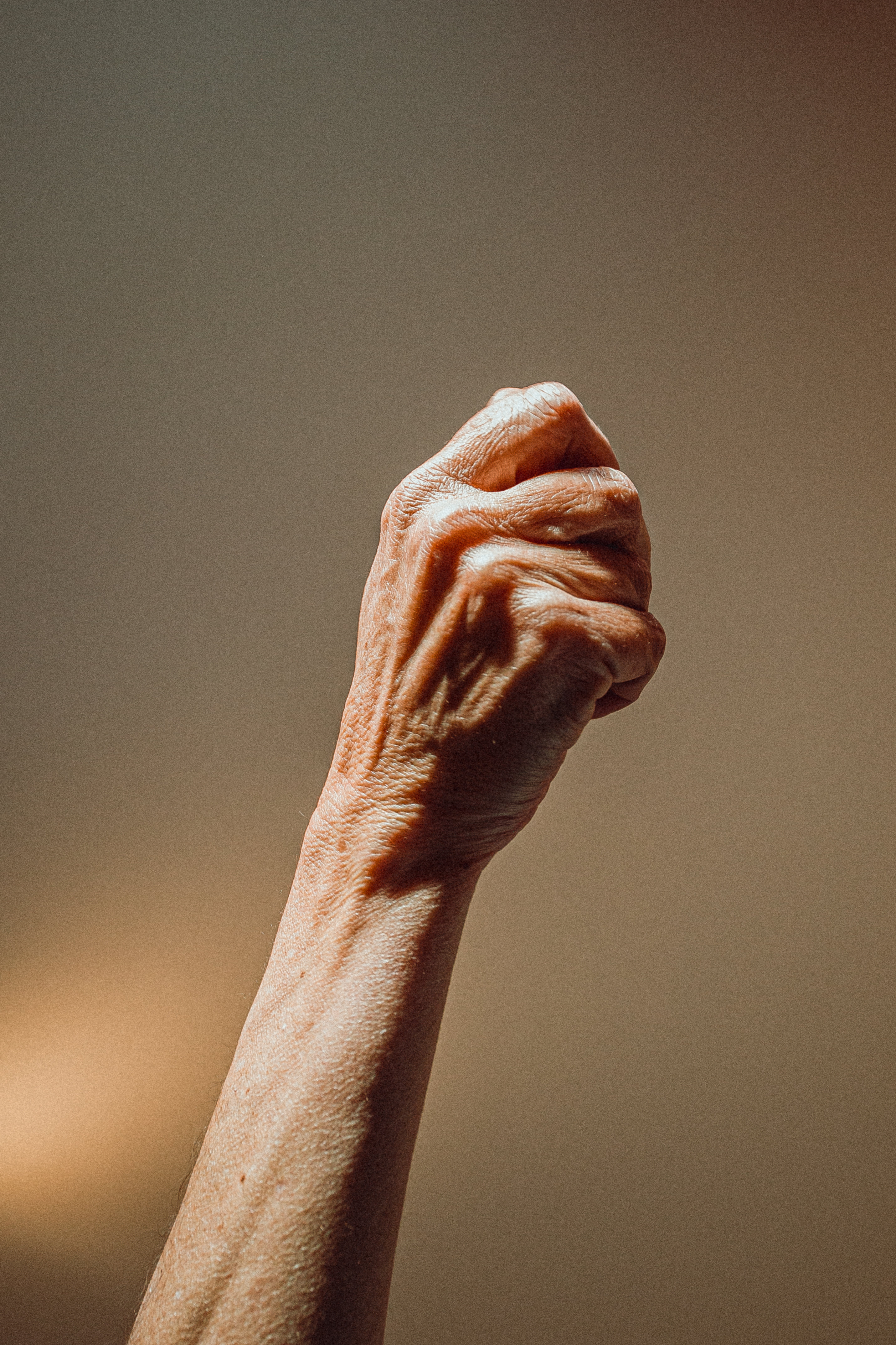 Browse Free HD Images of Elderly Person Raises Their Fist