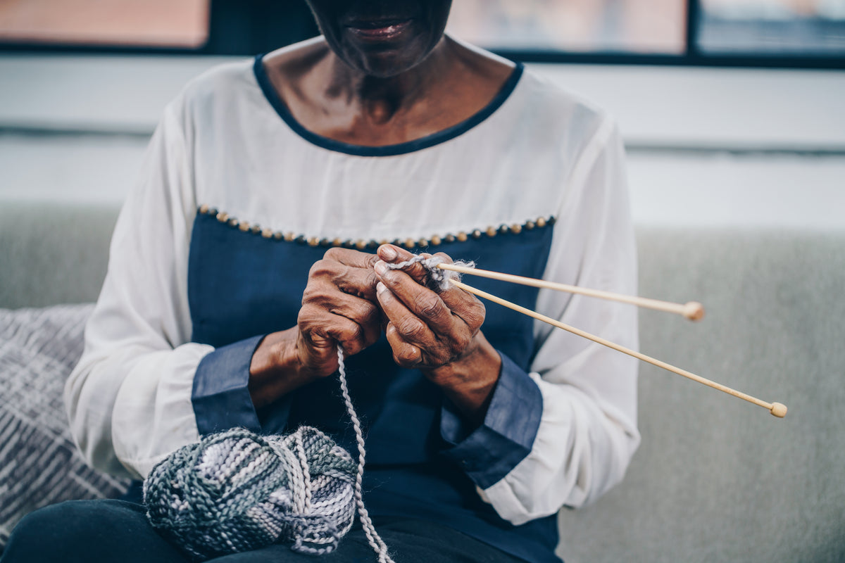 elderly woman knitting