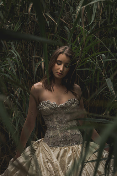 elegant serene woman in tall grass