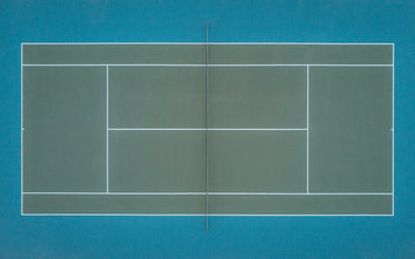 emerald green tennis court as seen from above by a drone