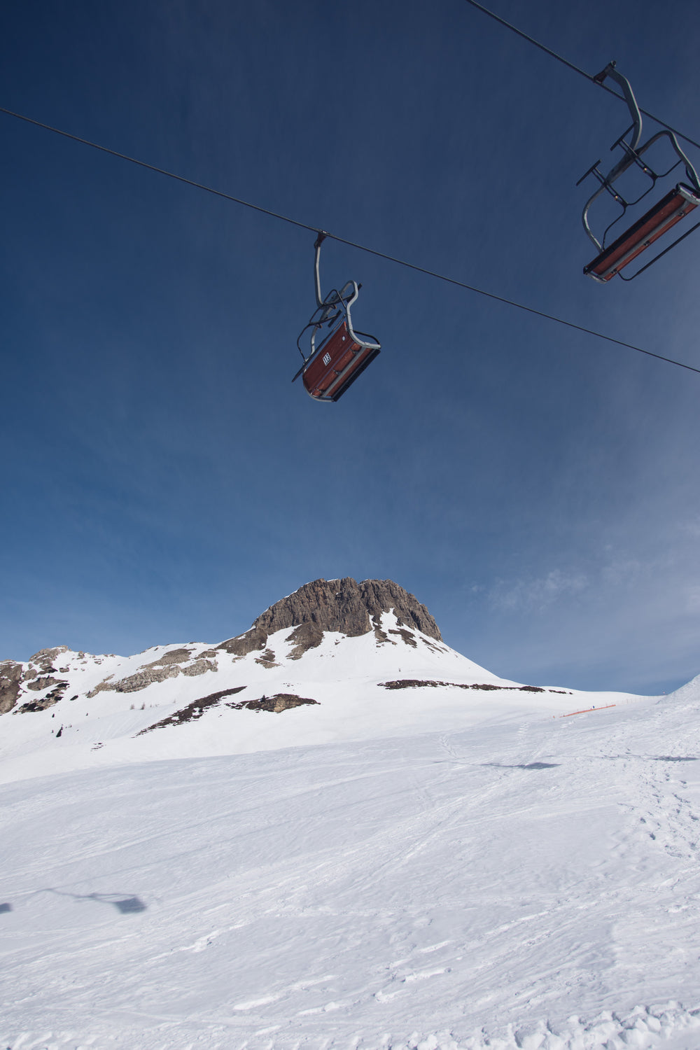 empty chairlifts on a cable
