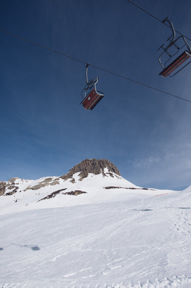 empty chairlifts on a cable