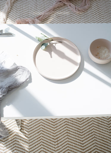 empty plate with leaf on white background