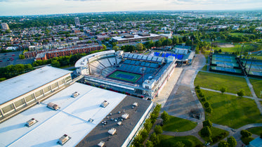 empty tennis courts with a cloudy horizon