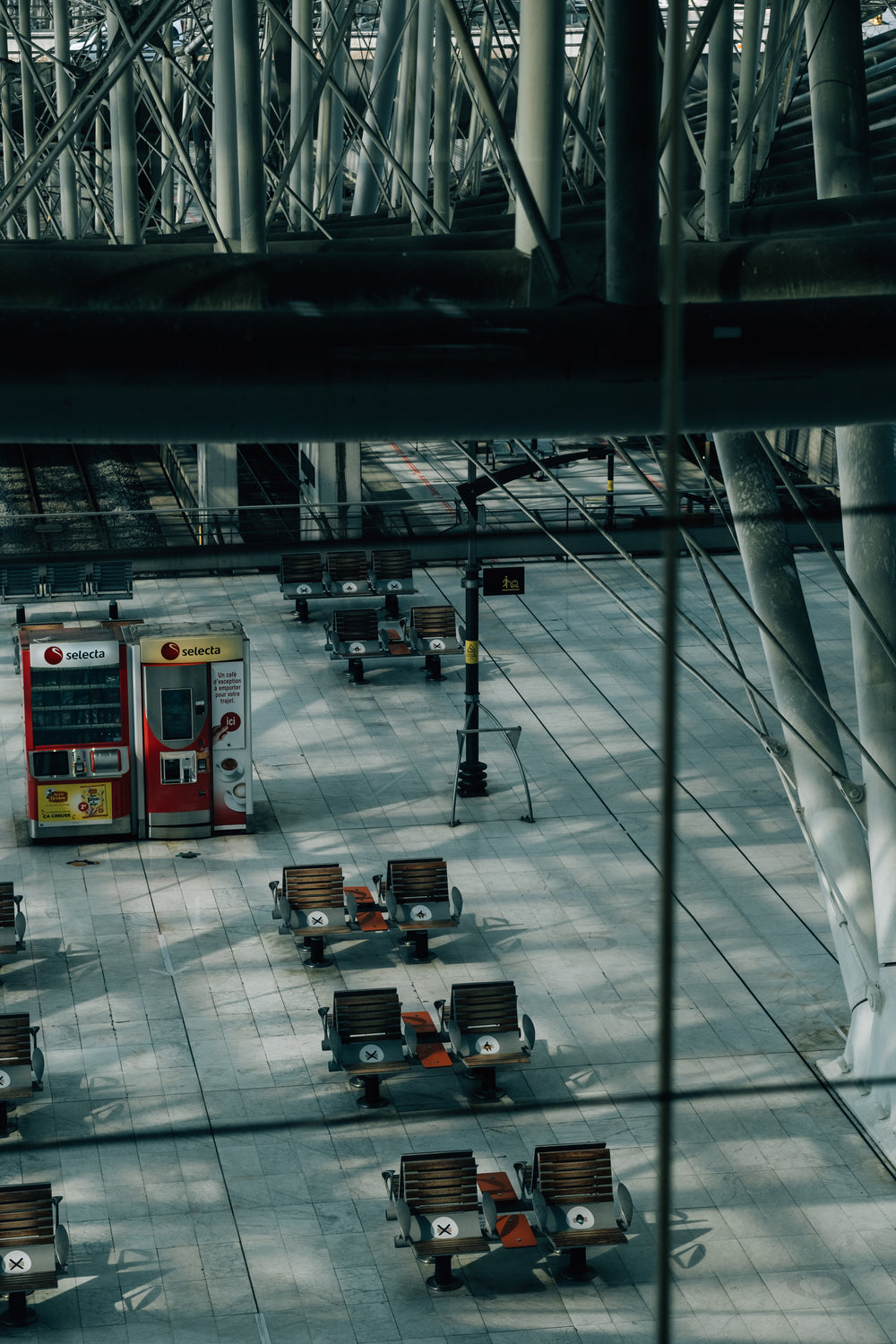 empty train station with chairs indicating restrictions