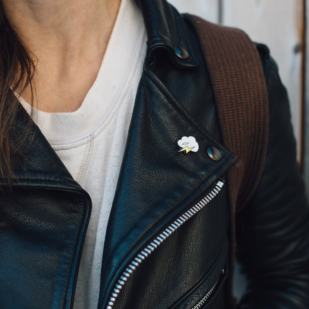 enamel pin on leather jacket