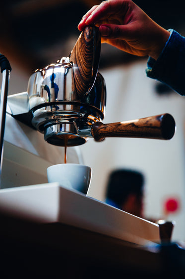 espresso machine with dark wood handles
