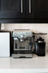 espresso maker on white stone counter
