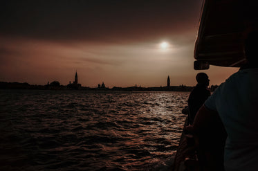 evening boat ride on wavy water by the city