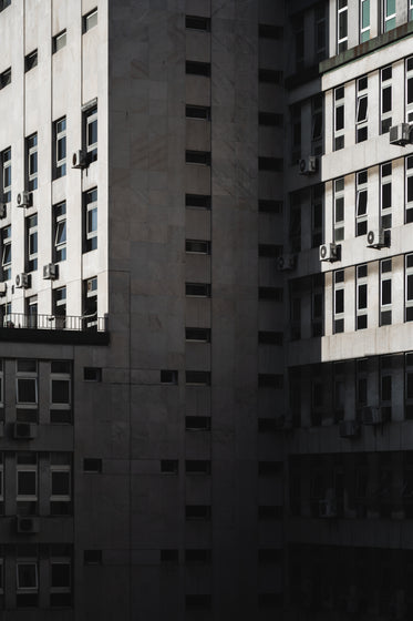 exterior walls of pristine tall building covered in windows