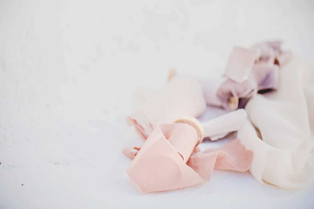 fabric and ribbons on white background