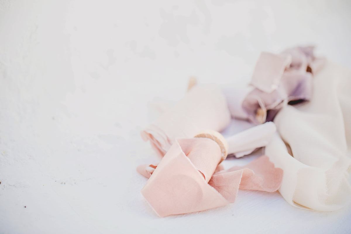 fabric and ribbons on white background