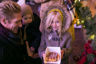 family at christmas market waffle win