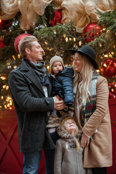 Free Family In Front Of Christmas Tree Image: Browse 1000s of Pics