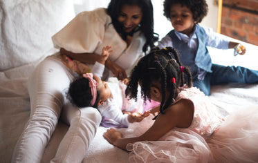 family playing in morning light