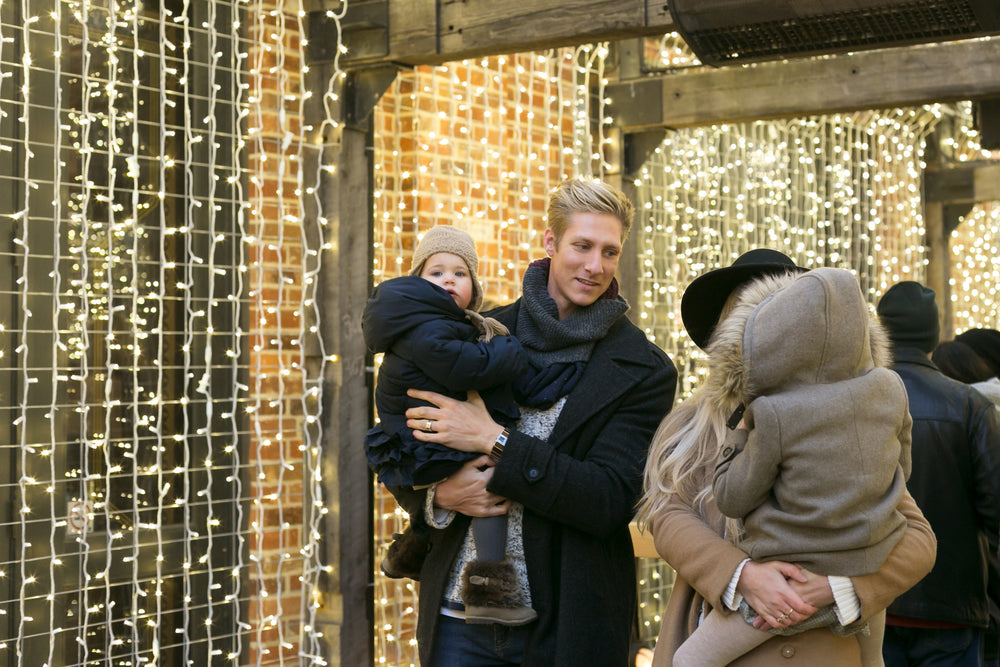 family with holiday lights