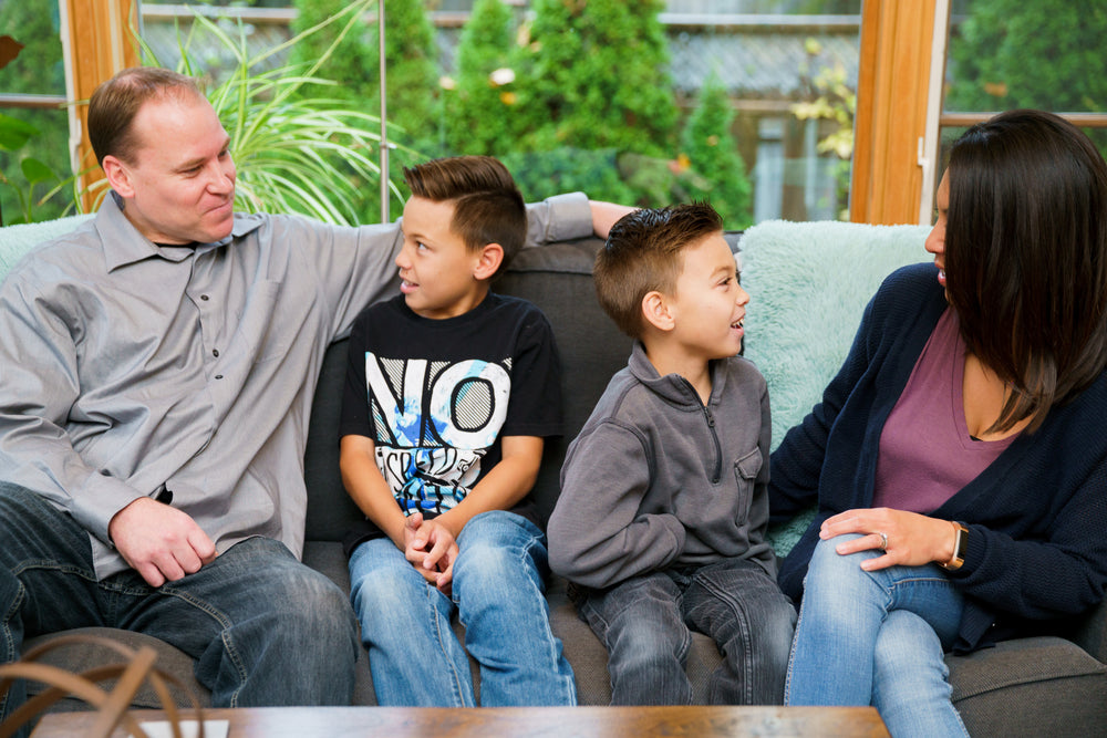 family sitting on couch