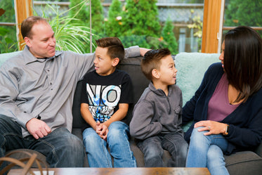 family sitting on couch