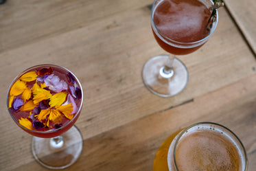 fancy cocktail with flower petals