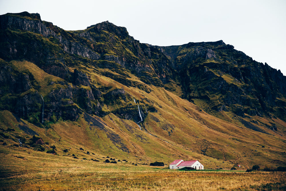 farm home near rocky cliffs