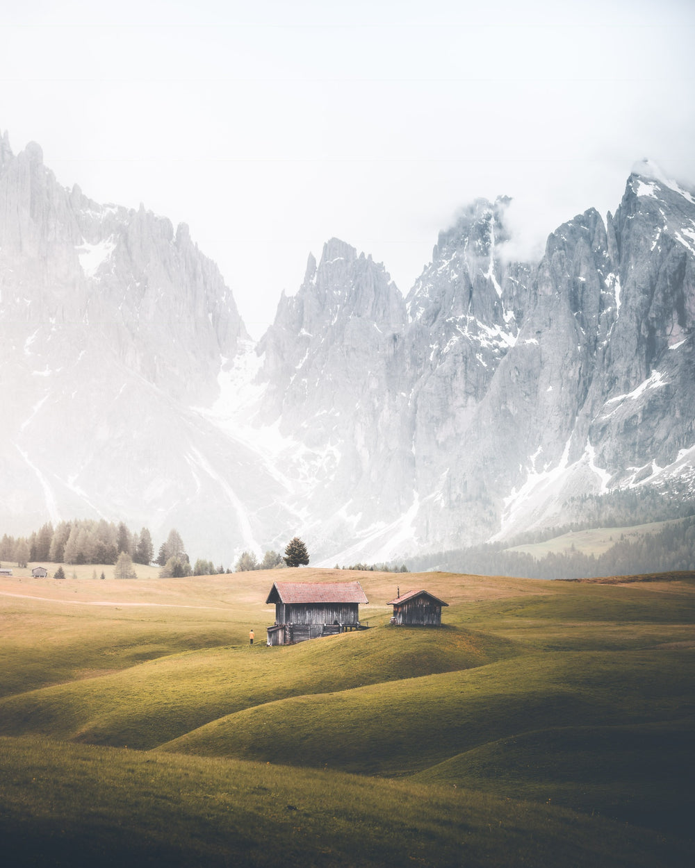 farmland in the foothills of snowy peaks