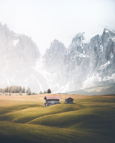 farmland in the foothills of snowy peaks