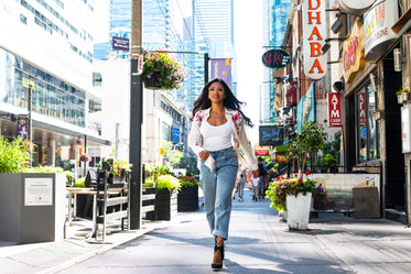 fashion model walks down city street