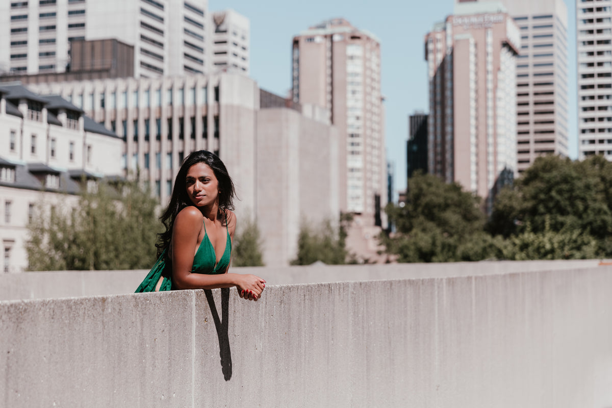 fashionable woman with high rises behind