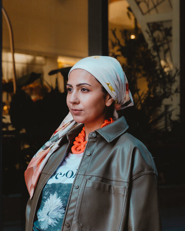 fashionably dressed woman in headscarf