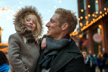 father and daugher smiling