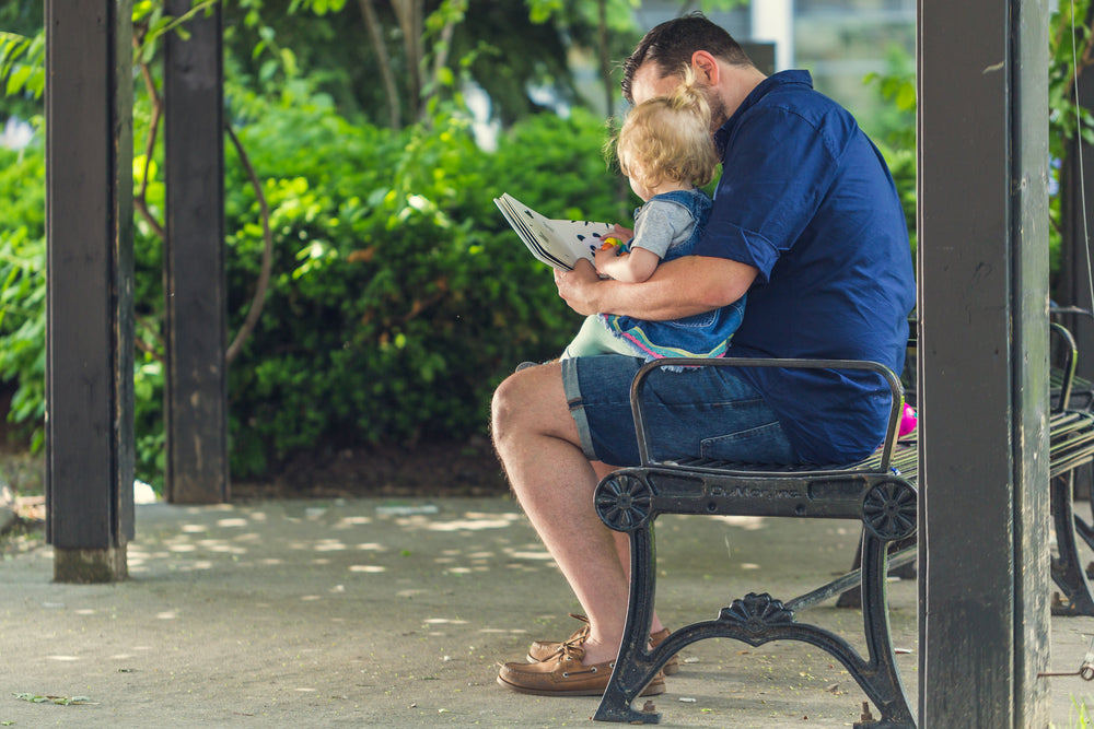 father reading to daughter