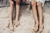 feet in beach sand