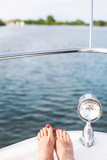 feet rest on a boat bow