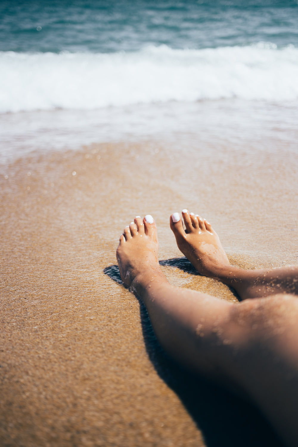 feet sink into sand