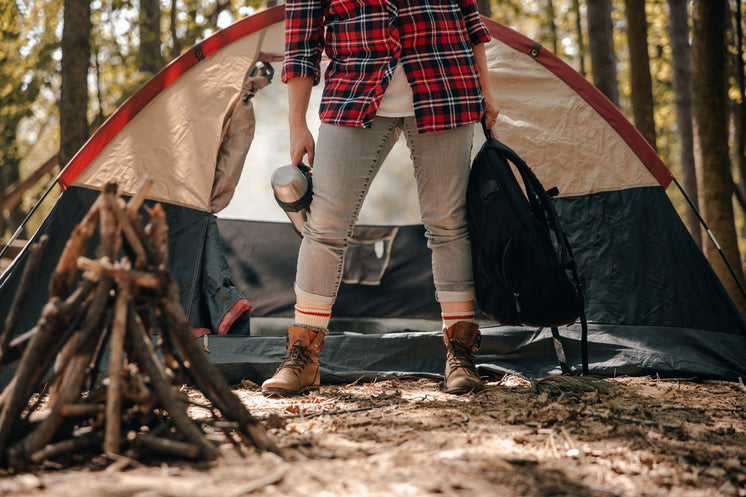 female-camper-holding-supplies-in-front-