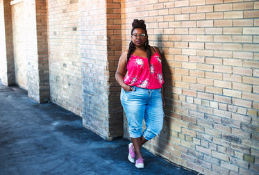 female fashion model poses in city street