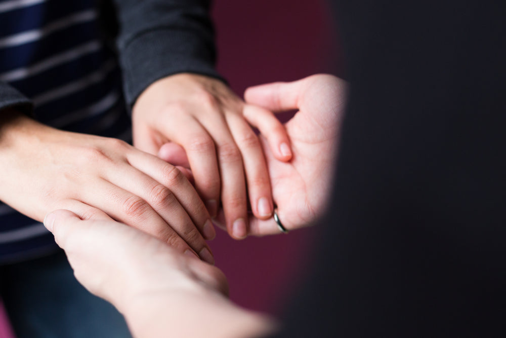 feminine hand holding