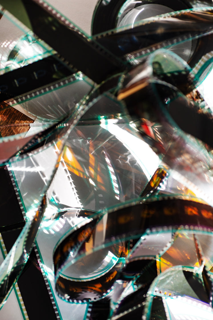 film-reel-catches-light-tangled-on-a-whi