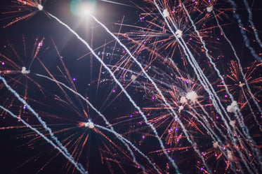 fireworks streaking across black sky