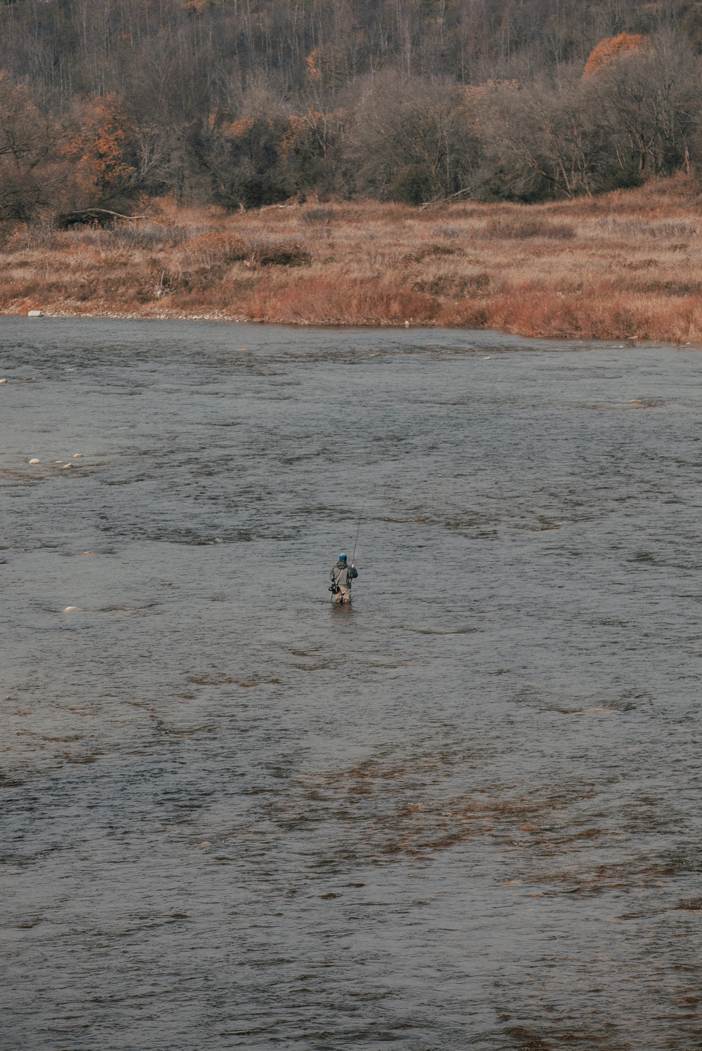 fisherman looks towards shore