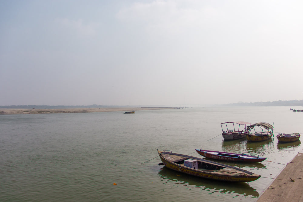 five boats on still water