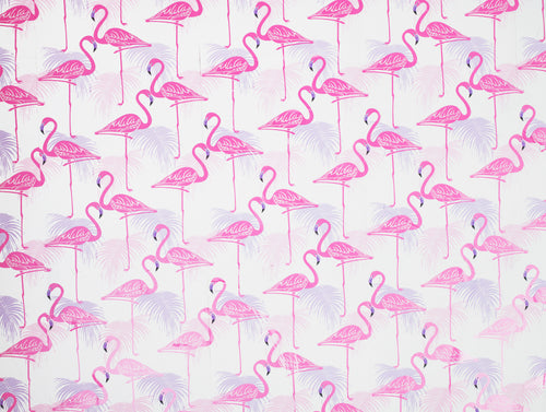 flamingos and palm leaves adorn a wall