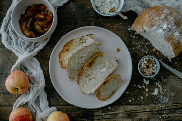flat lay of baked bread with apples and oats