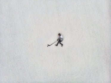 flat lay view of hockey player against the ice