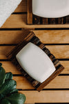 flatlay of bars of white soap on a wooden surface