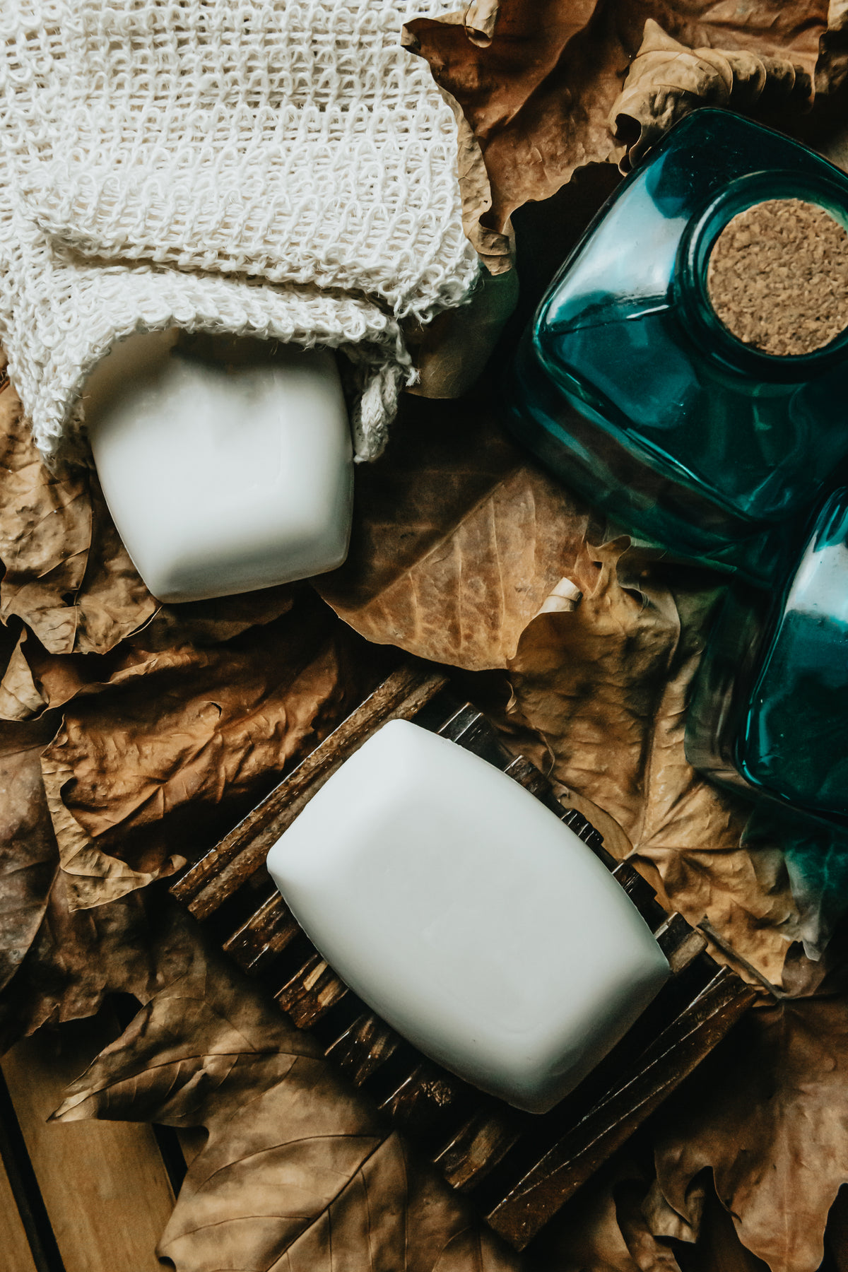flatlay of soap and dried crispy leaves