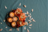 flower petals huddled together near a candle