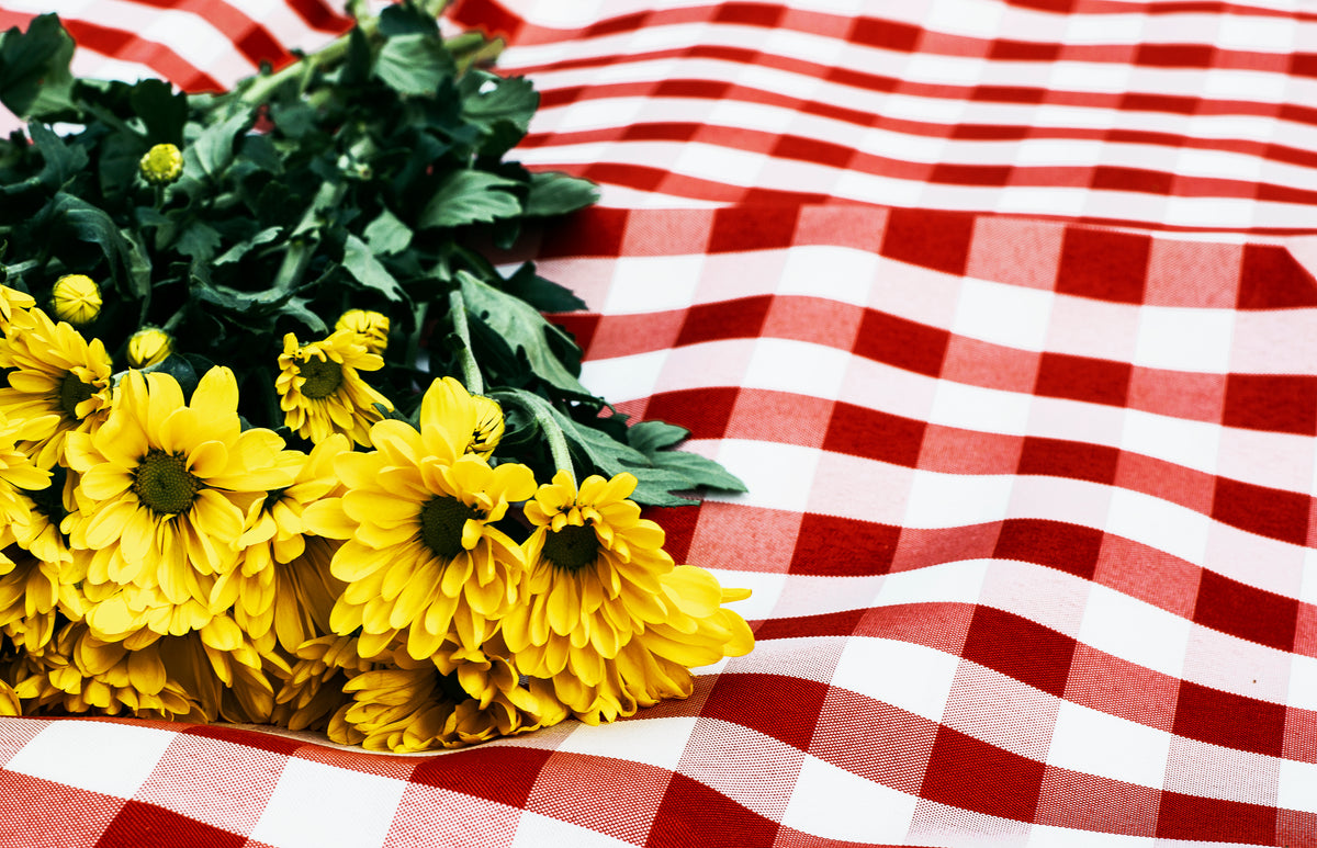 flowers on picnic blanket