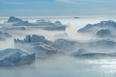fog rolls over icey glaciers