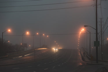 foggy city bridge at night